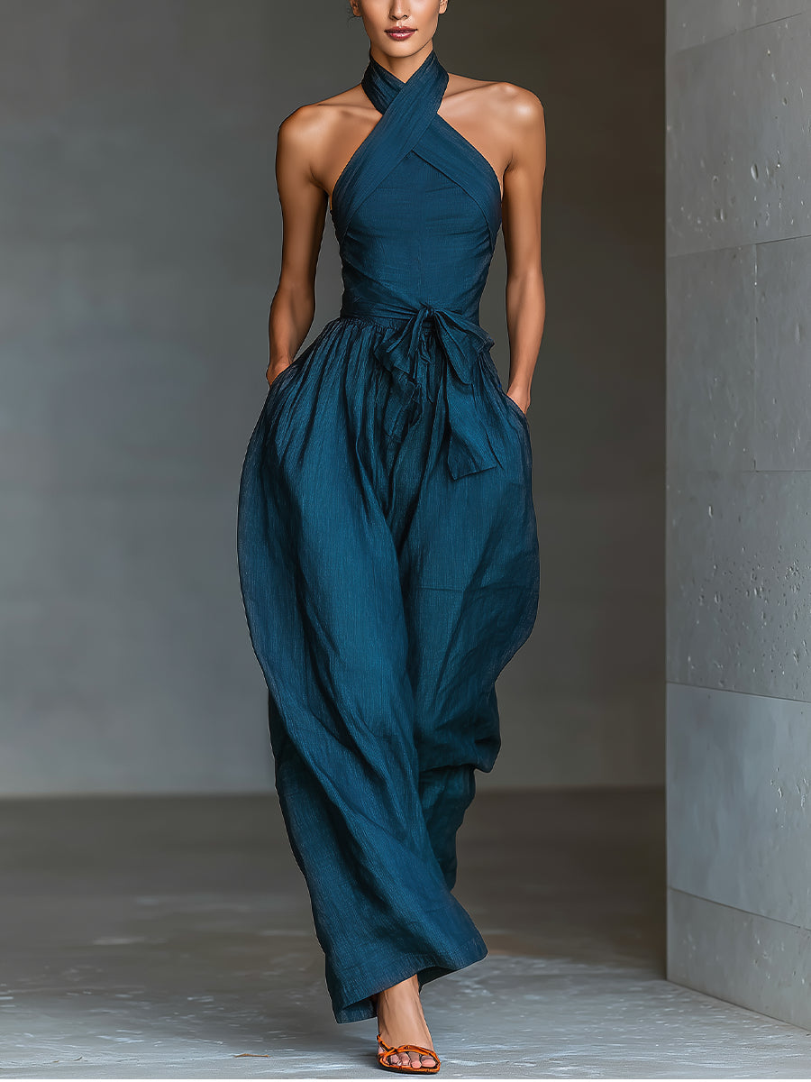 Venusta | Tuta blu navy con scollo halter incrociato e gamba ampia