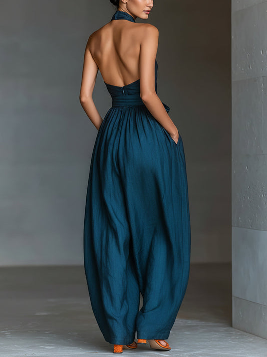 Venusta | Tuta blu navy con scollo halter incrociato e gamba ampia