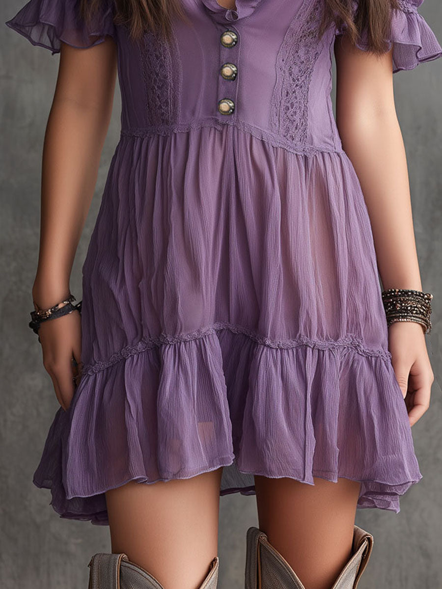 Abito corto in chiffon viola con maniche a sbuffo, balze e bottoni frontali