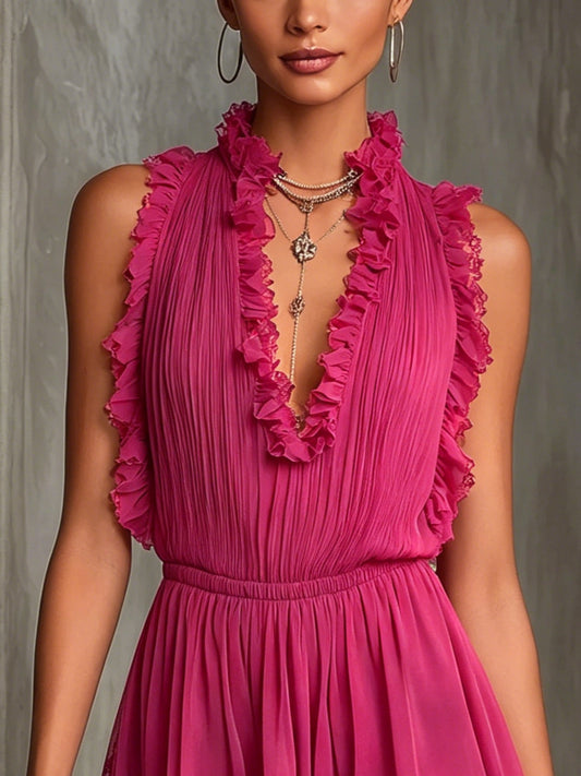 Tuta plissettata in chiffon con pizzo fucsia e bordo a volant