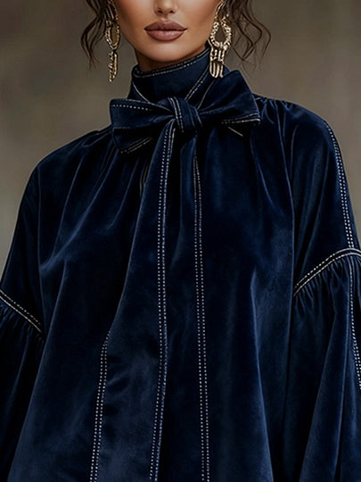 Vestito corto in velluto blu scuro con fiocco e maniche a lanterna