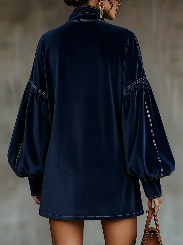 Vestito corto in velluto blu scuro con fiocco e maniche a lanterna