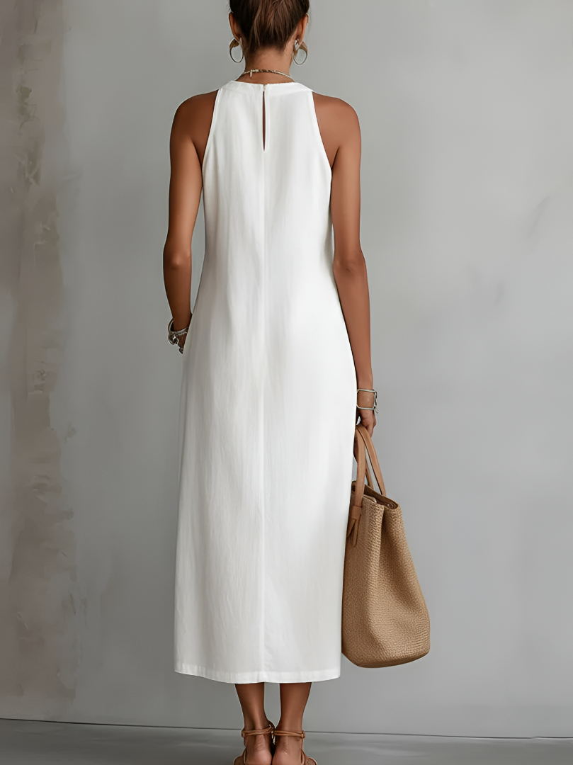 Alessandra | Abito midi smanicato bianco con dettagli ricamati e tasche laterali